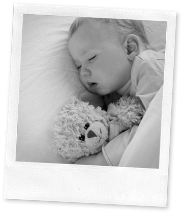 Baby sleeping in bed